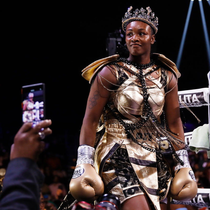 Claressa Shields in a gold boxing outfit.