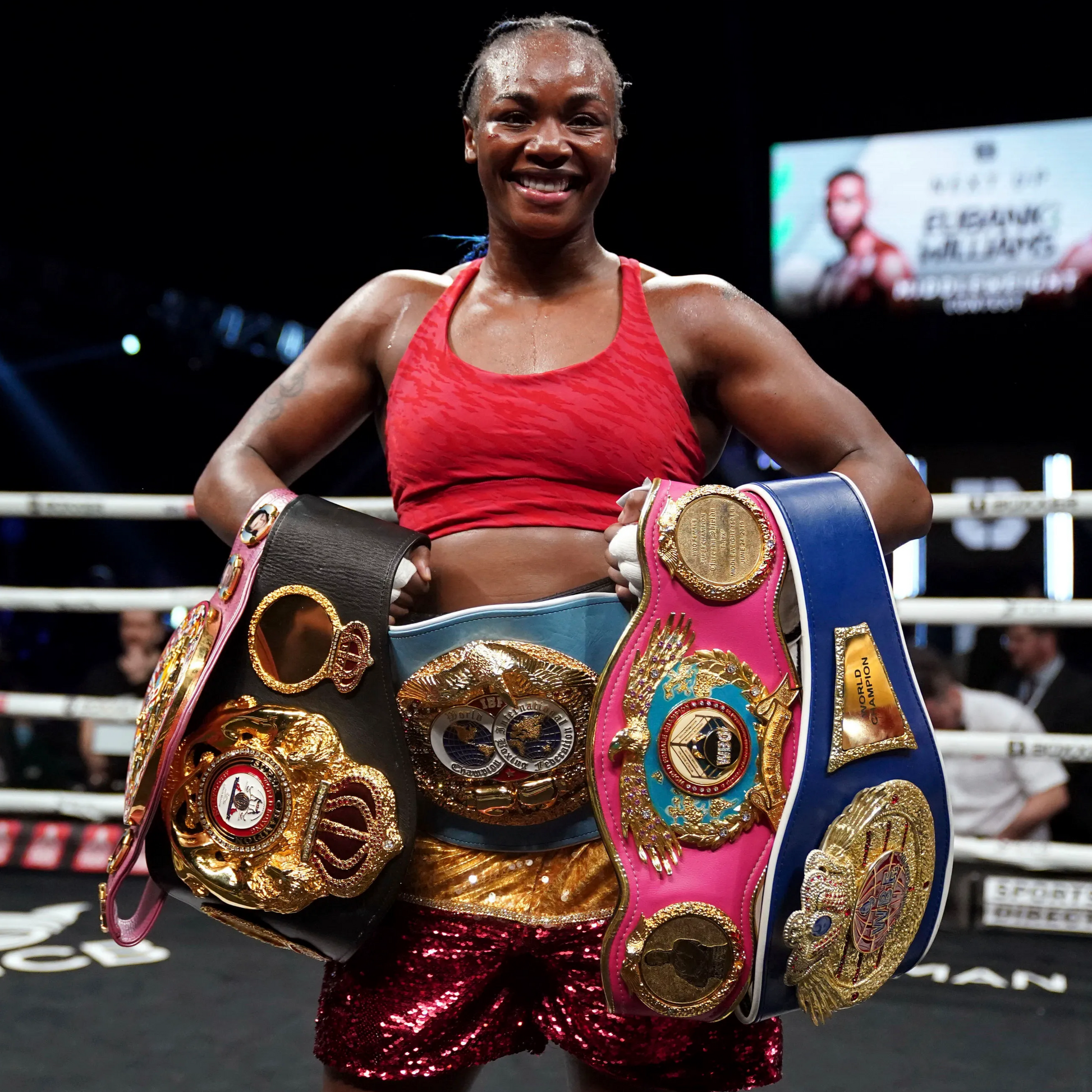 Claressa Shields poses with her belts
